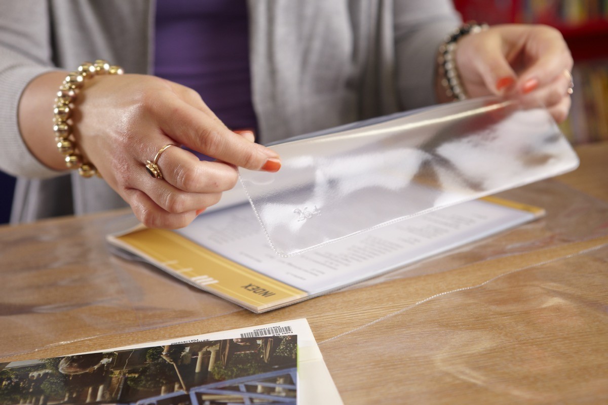 A female fitting library book jackets